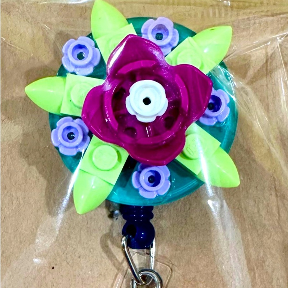 Lego brick flower badge reel
